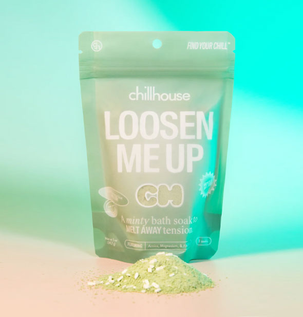 5 ounce green bag of Chillhouse Loosen Me Up bath soak with some powdery contents piled in front