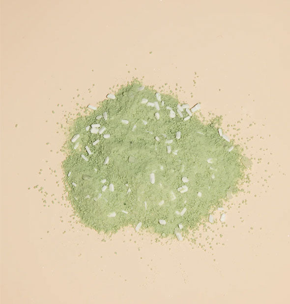 A pile of green, grainy bath soak powder