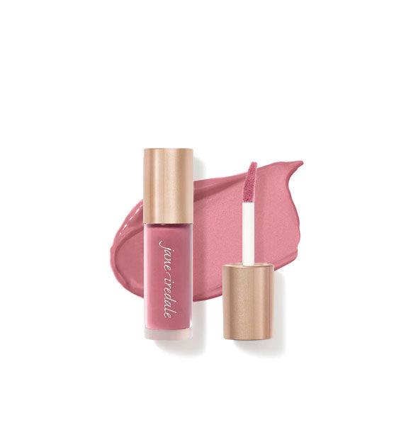 Tube of Jane Iredale Beyond Matte Lip Stain with separate gold doe foot applicator cap rest atop an enlarged sample application of product in shade Lovestruck