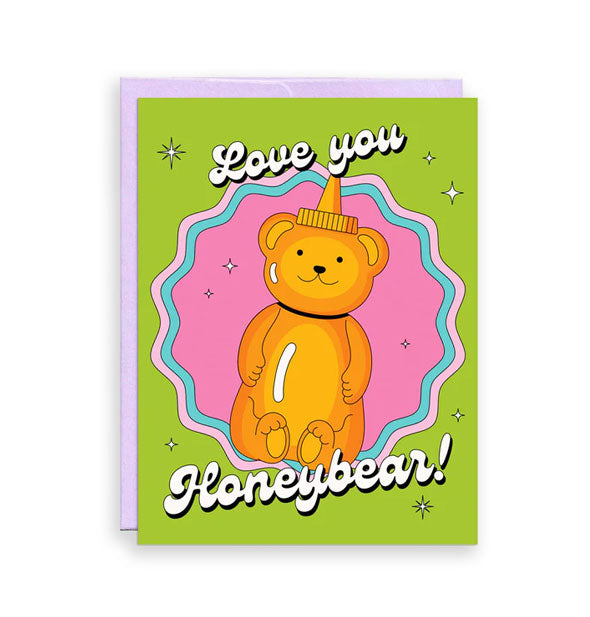 Green greeting card backed by a purple envelope features illustration of a bear-shaped honey bottle and the message, "Love you Honeybear!" in white bubble script lettering
