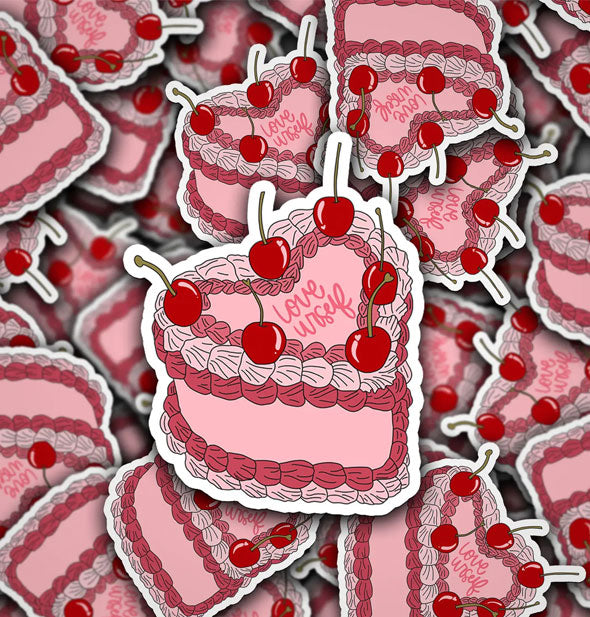 Pile of stickers with cherry-topped heart-shaped cake design say, "Love Urself"