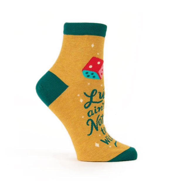 Mustard yellow crew socks with dark green ankle band, heel, and toe feature colorful die design and dark green lettering