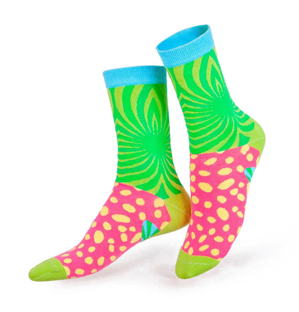 Colorful crew socks with green radial design on ankles, blue top band, pink with yellow polka dots on tops of feet, and green heels and toes
