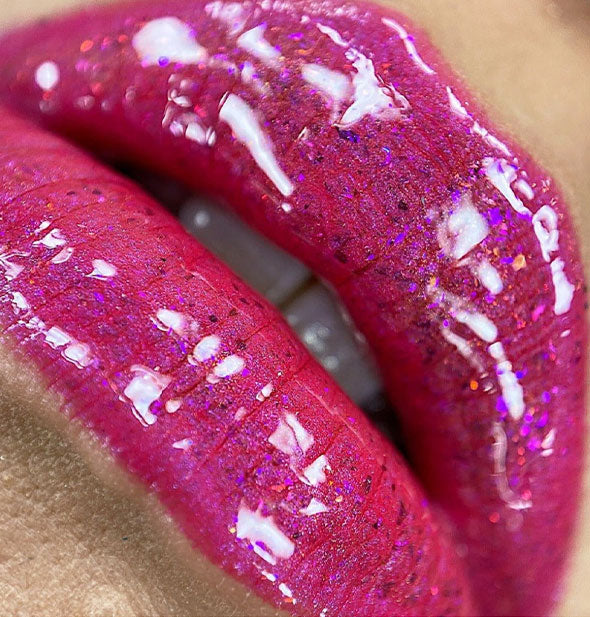 Closeup of very pink, ultra-shiny lips