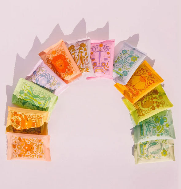 Assortment of Zodiac Bath Soak packets in an overlapping arced spread