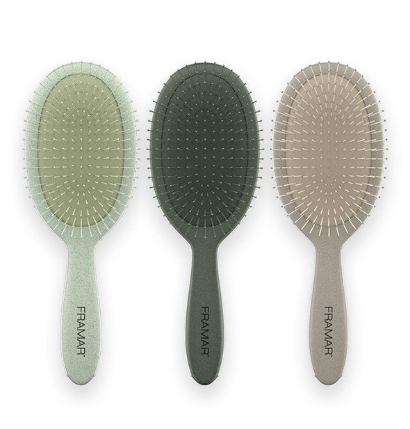 Group of three Framar hairbrushes in light green, dark green, and beige