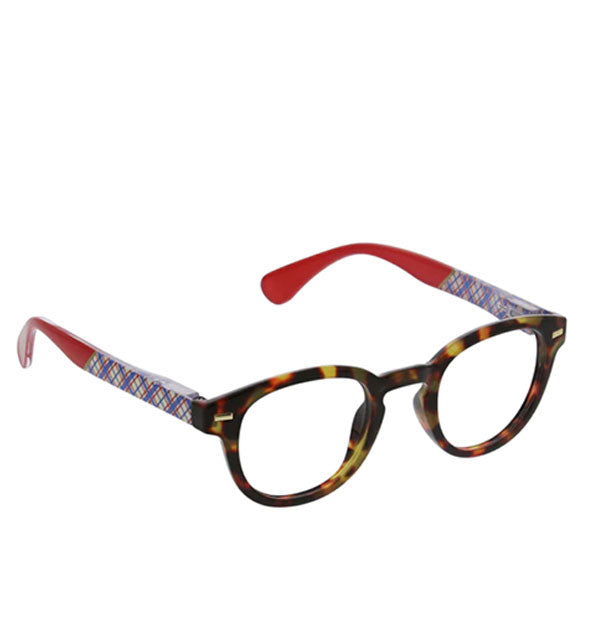 Reading glasses with round brown tortoise eyes and color blocked plaid temple arms with red ear pieces