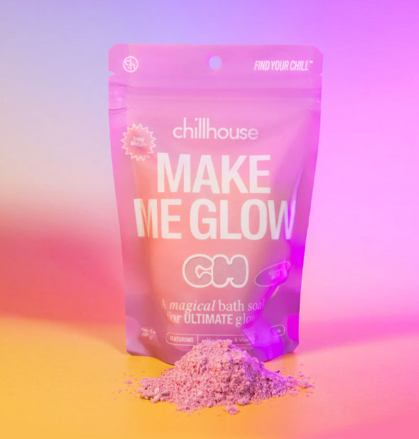 Purple 5 ounce pouch of Chillhouse Make Me Glow bath soak with small pile of powdered contents in front