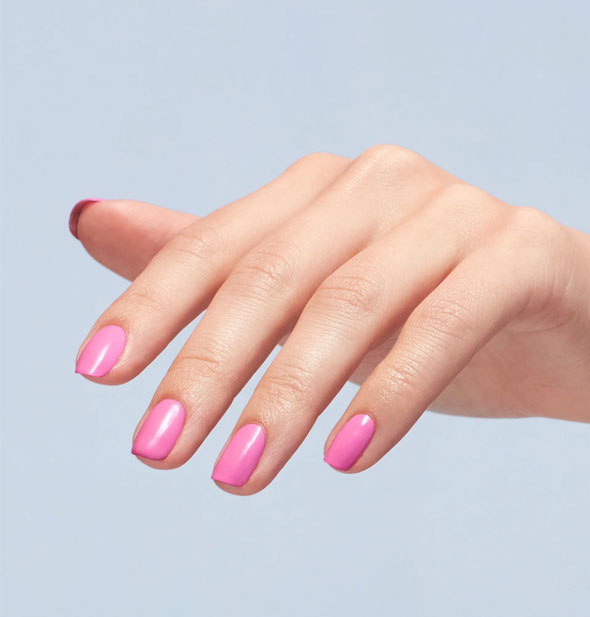Model's fingernails are painted with bubblegum pink polish