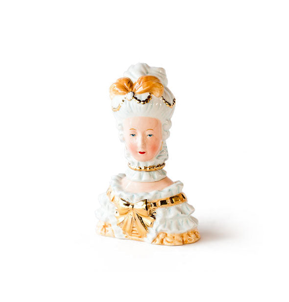 White and gold ceramic figurine designed to resemble Marie Antoinette