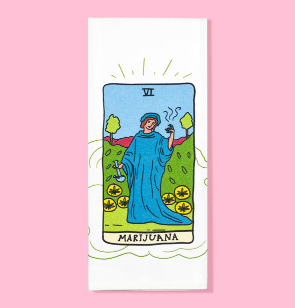 White dish towel features tarot card-style illustration of a figure in a blue cloak surrounded by pot leaves labeled, "Marijuana"