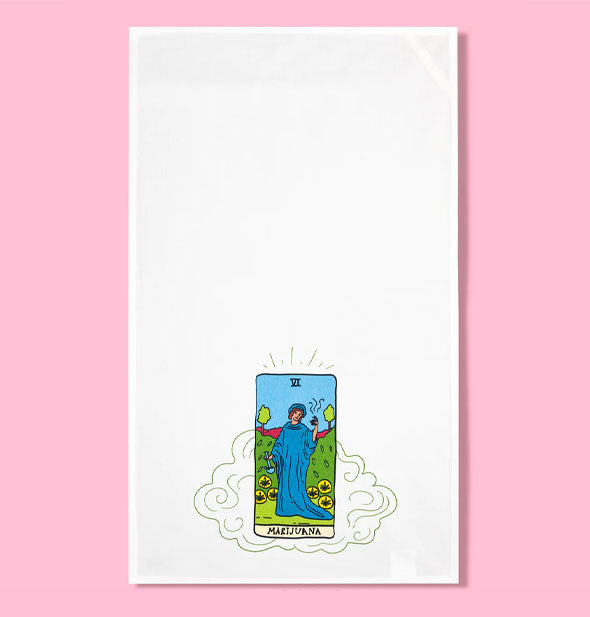 White dish towel features tarot card-style illustration of a figure in a blue cloak surrounded by pot leaves labeled, "Marijuana"