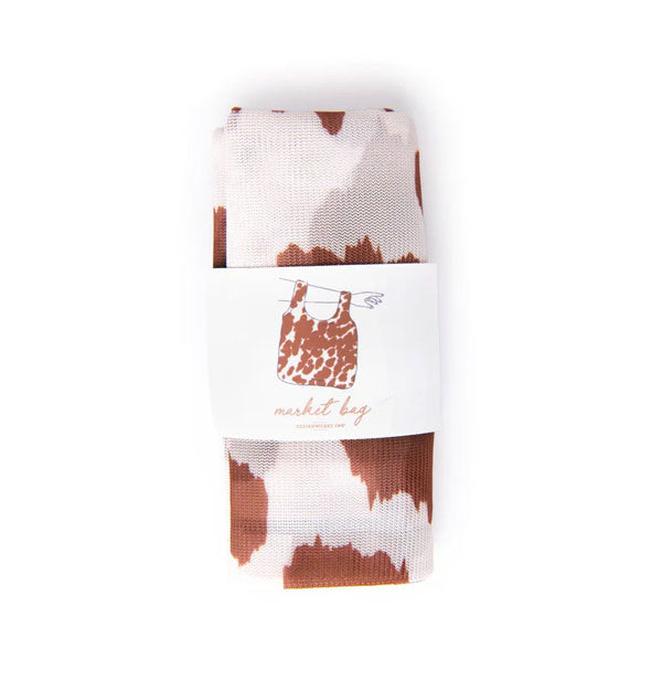 Folded brown and white cowhide print Market Bag in wrap-around packaging