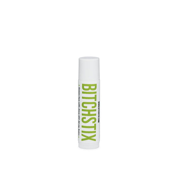 White tube of Bitchstix lip balm with green lettering