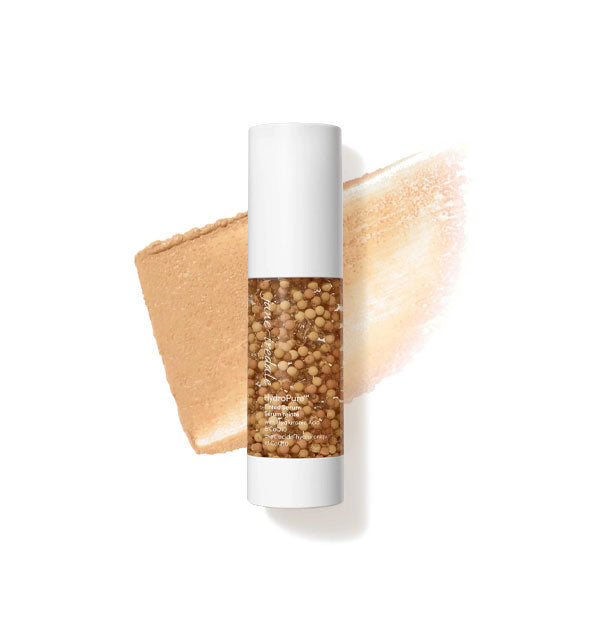 Bottle of Jane Iredale HydroPure Tinted Serum with color capsules visible through clear packaging and a sample application behind in the shade Medium to Dark 5
