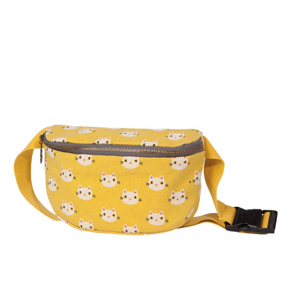 Yellow fanny pack-style bag with all-over white kitty face illustrations and a yellow belt with black clasp
