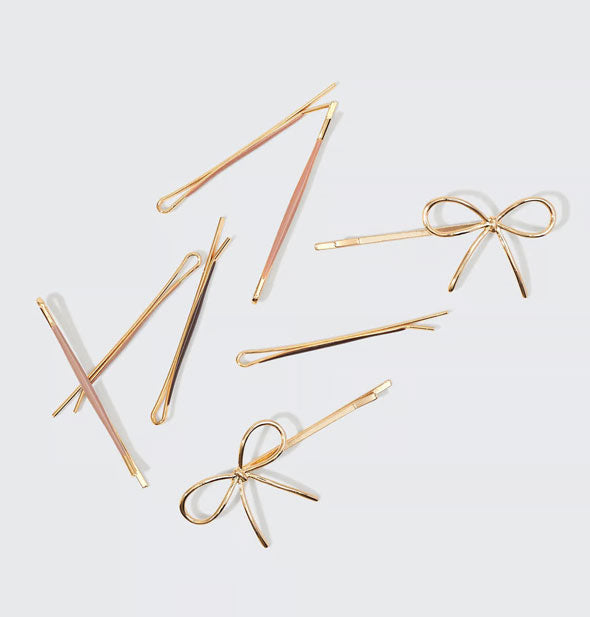 Neutral enamel-covered and gold bow bobby pins