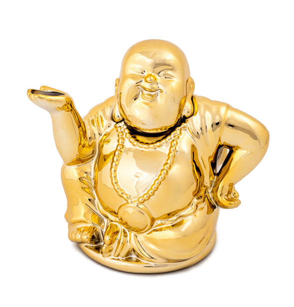 A metallic gold teapot in the shape of a smiling buddha