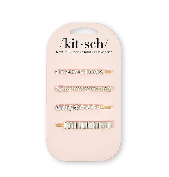 Set of four gold-toned bobby pins with rhinestone accents are attached to a light pink Kitsch product card