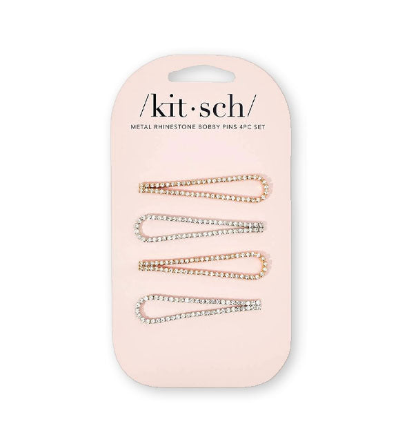 Four rhinestone-encrusted teardrop-shaped bobby pins, two gold and two silver, attached to a light pink Kitsch product card