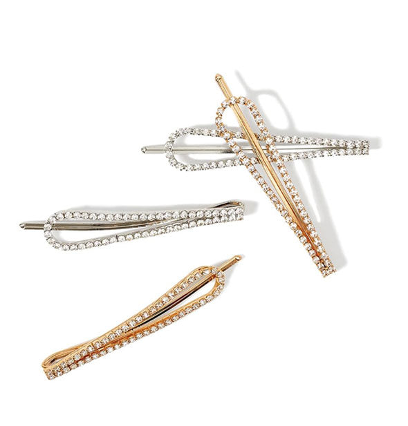 Two gold and two silver teardrop-shaped rhinestone-encrusted bobby pins