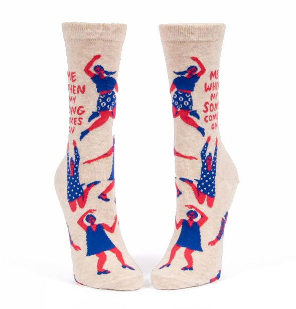 Cream-colored socks featuring red and white illustrations of people dancing say, "Me when my song comes on"