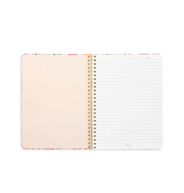 Opened spiral-bound notebook reveals a blank cream-colored page at left and a white lined page at right