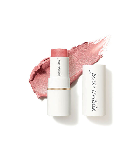 White tube of Jane Iredale Glow Time Blush Stick with cap removed and sample product application behind in shimmery shade Mist
