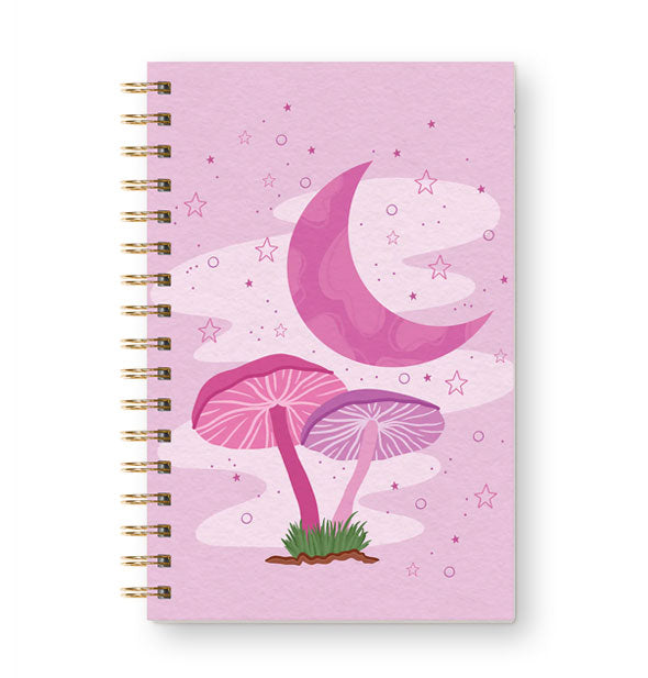 Pinkish-purple notebook cover with gold twin ring spiral binding features illustration of two mushrooms under a starry sky with pink crescent moon