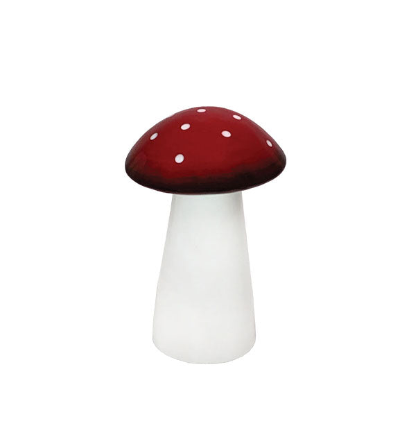 Red and white mushroom lamp (unlit) with small white polkadots on its red cap