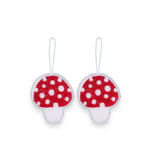 Pair of white and red speckled mushroom dish sponges each with a white hanging cord