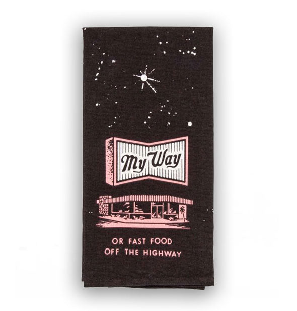 Dark dish towel with retro-style building under a starry sky accented with pink says, "My way or fast food off the highway"