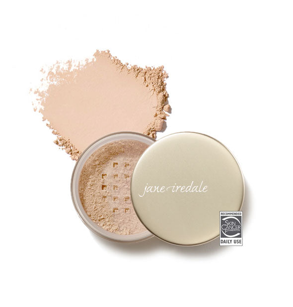 Opened compact of Jane Iredale Amazing Base Loose Mineral Powder and sample product swatch in shade Natural with the Skin Cancer Foundation seal at lower right