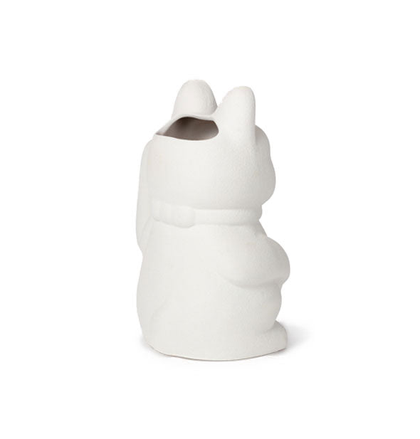 Three-quarter rear view of white ceramic maneki-neko cat vase shows opening in the top