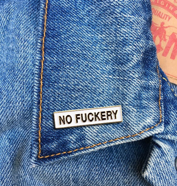 No Fuckery pin on jean jacket lapel