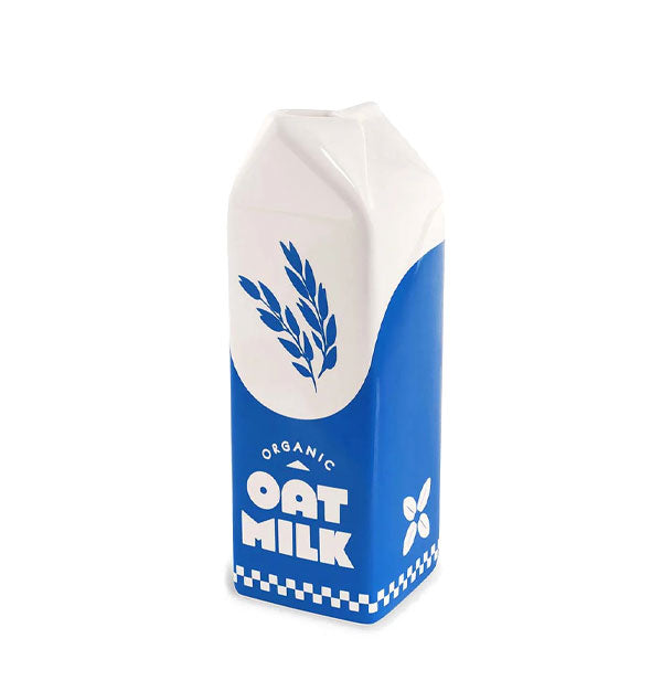 Blue and white ceramic carton-shaped vase says, "Organic Oat Milk" with graphics