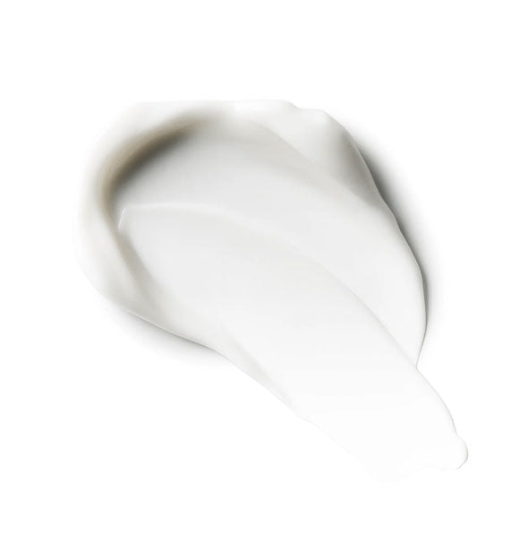 Smeared application of creamy white moisturizer