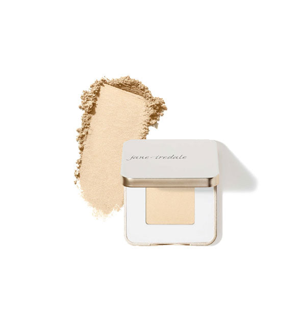 Opened square white and gold Jane Iredale eye shadow compact with sample product application at left in the shade Oyster