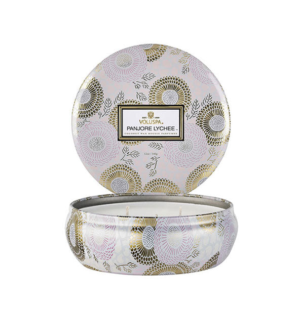 Round white and gold Panjore Lychee Voluspa candle tin with lid removed