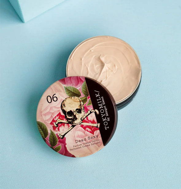 Opened round tin of TokyoMilk's Dead Sexy Parfum Crema Délice—a cream perfume tin with dolloped product visible inside