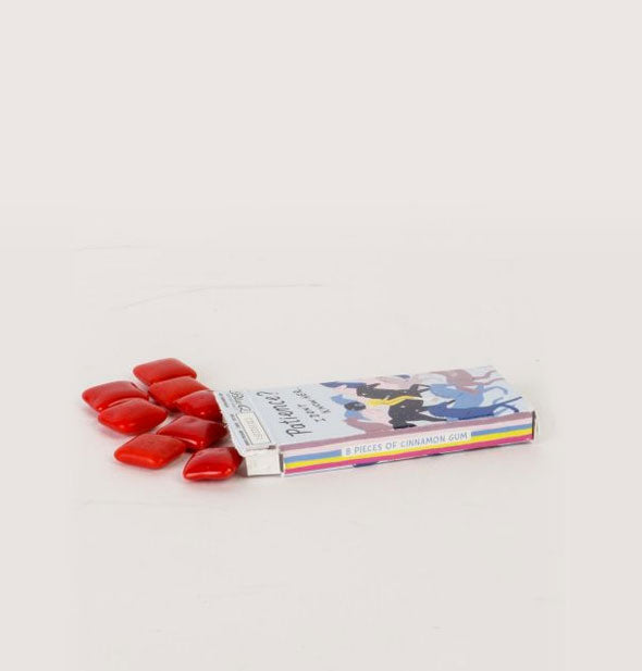 Slim box on its side spills out pieces of red chewing gum
