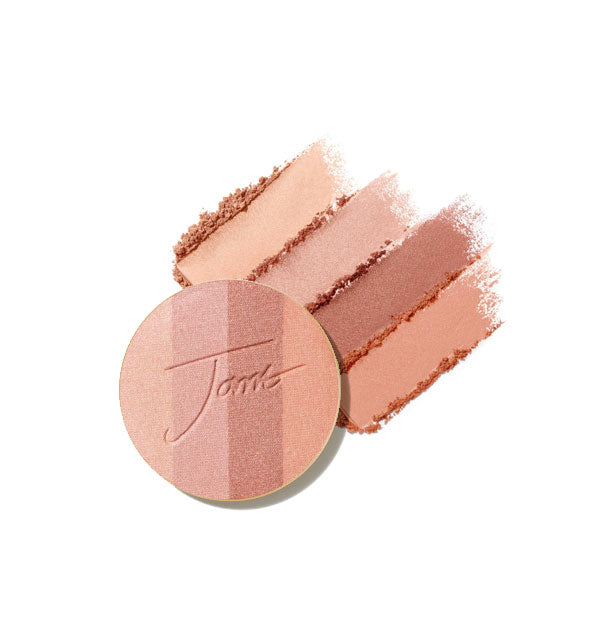 Four-shade bronzer pressed powder compact refill disc stamped with "Jane" is placed in front of crumbled and streaked applications of each shade in Peaches & Cream option