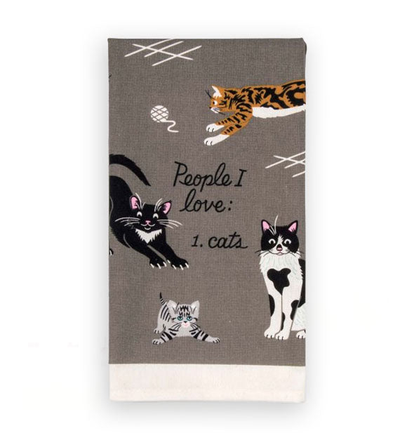 Gray dish towel with white border features illustrations of cats in various colors and patterns arranged around the words, "People I love: 1. Cats"