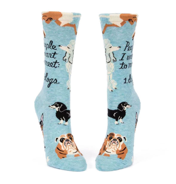 Blue crew socks with illustrations of various dog breeds say, "People I want to meet: 1. Dogs" in black script