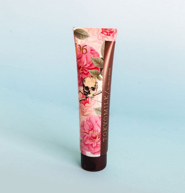 Tube of TokyoMilk shower gel features a pink floral design with skull and crossbones graphic at center
