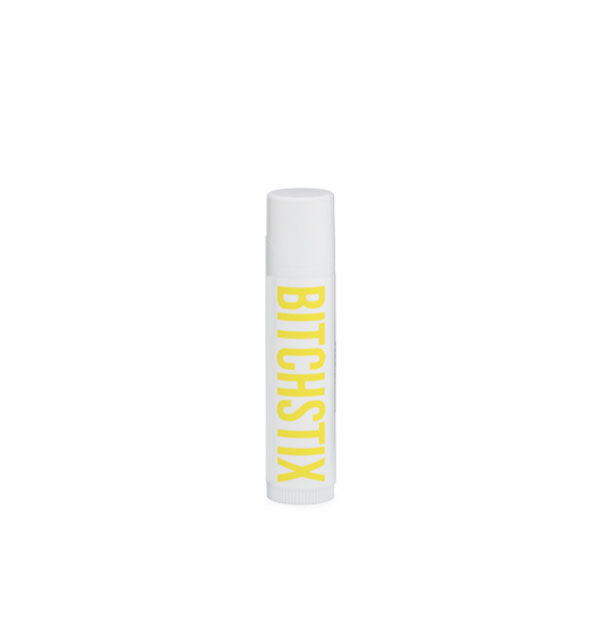 White tube of Bitchstix lip balm with yellow lettering
