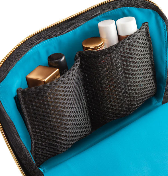 Inside of KUSSHI Everyday Makeup Bag shows blue lining and black mesh slip pockets