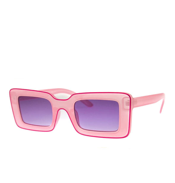 Pair of rectangular light pink sunglasses with a dark pink pinstripe and purple lenses