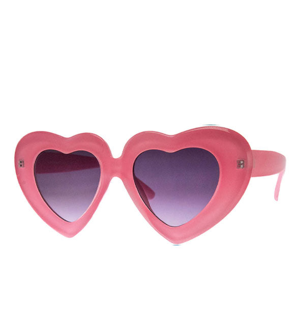 Pink heart-shaped sunglasses with thick frame and purple lenses