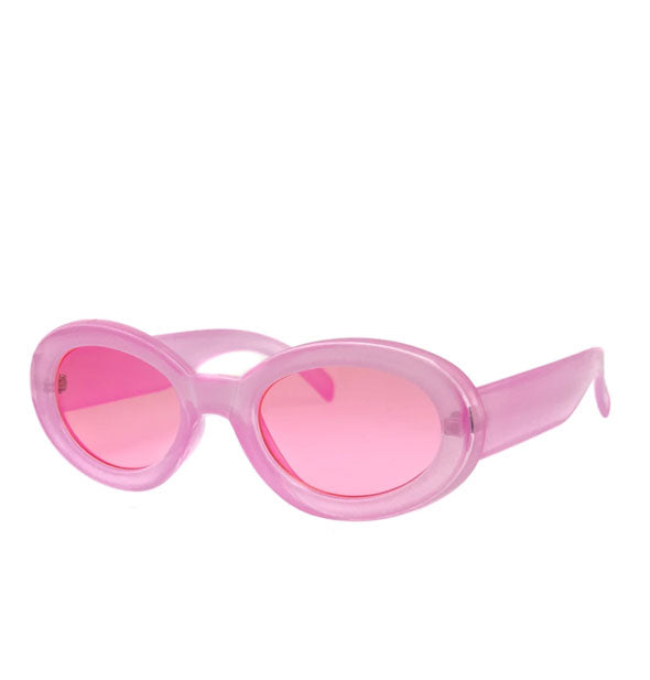Rounded thick-framed pink sunglasses with pink lenses